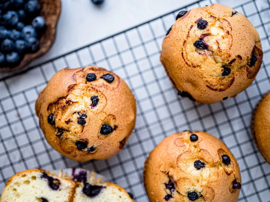 Freshly baked muffins cooling on a rack